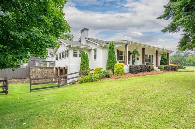 a front view of a house with garden