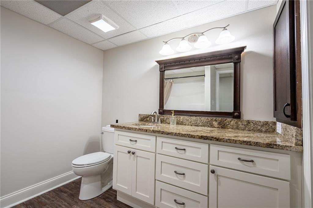 4067 Mason Creek Road Winston, GA 30187 - Photo 32 of 48 a bathroom with a toilet sink and mirror