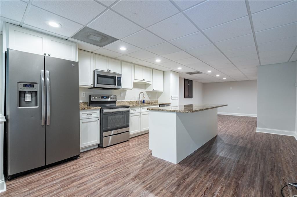 4067 Mason Creek Road Winston, GA 30187 - Photo 36 of 48 a kitchen with stainless steel appliances a refrigerator sink and microwave