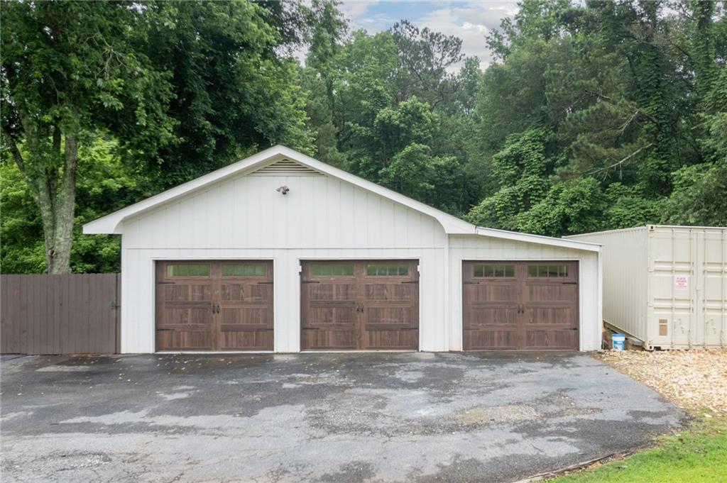 4067 Mason Creek Road Winston, GA 30187 - Photo 41 of 48 a front view of a house with a yard and garage