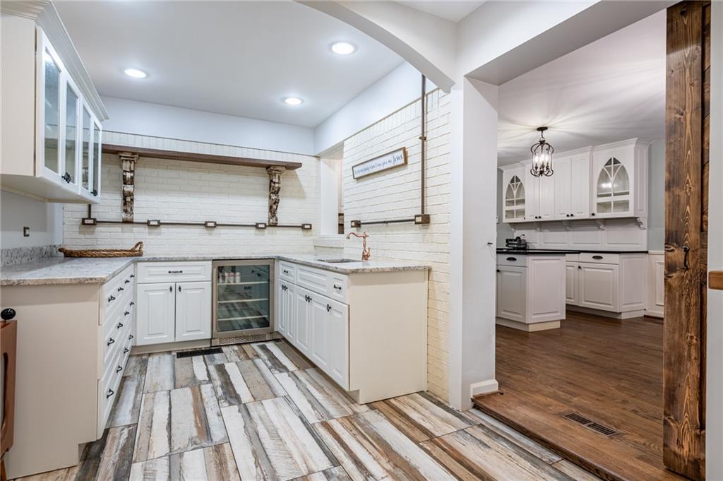 4067 Mason Creek Road Winston, GA 30187 - Photo 7 of 48 a kitchen with a sink stove cabinets and wooden floor