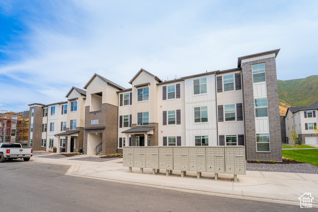 4735 Alder Drive, Unit F304 Mapleton, UT 84664 - Photo 1 of 1 View of front of house featuring board and batten siding and a residential view