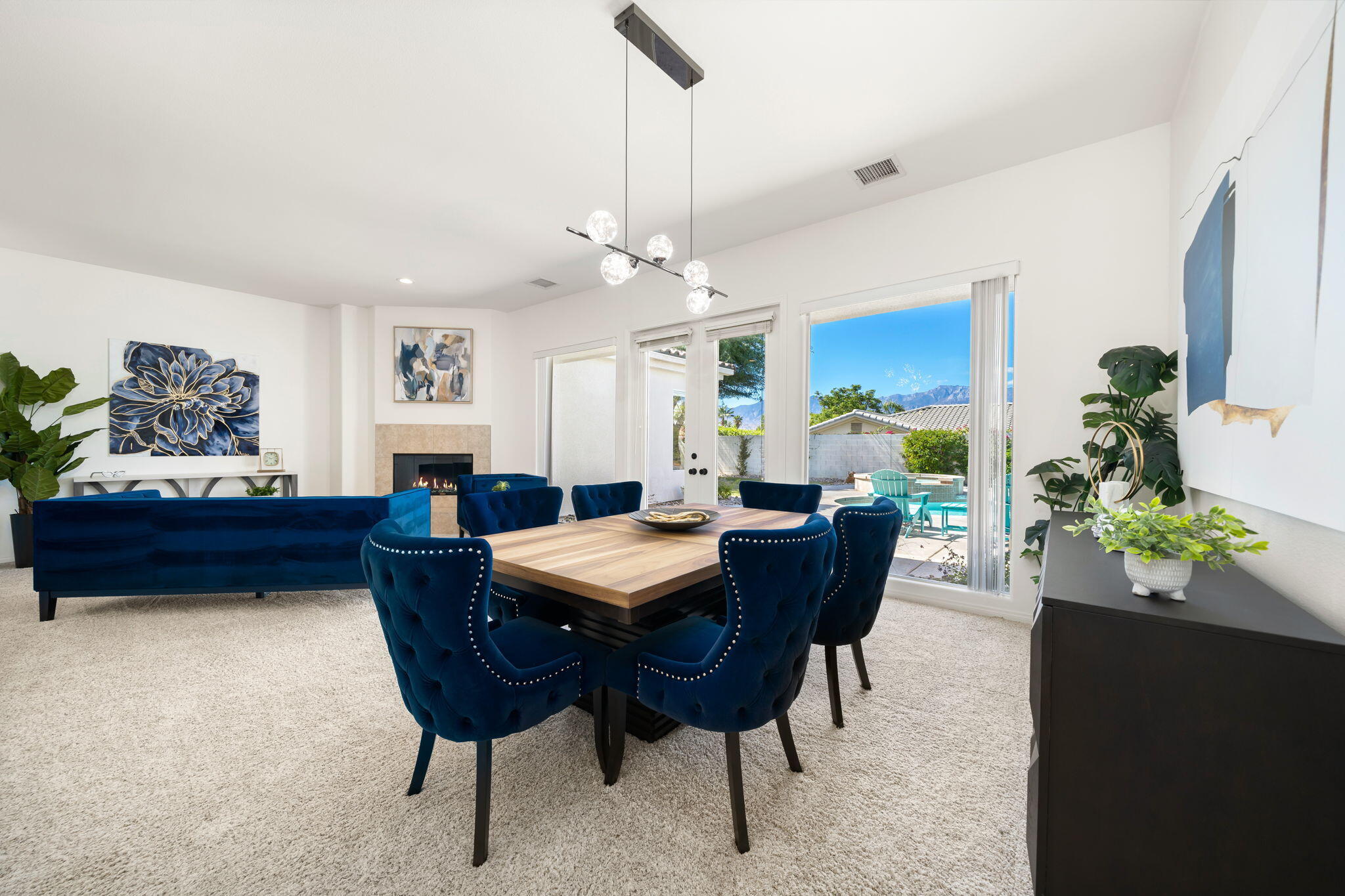 1 Waterloo Court Rancho Mirage, CA 92270 - Photo 11 of 54 a view of a dining room with furniture and chandelier