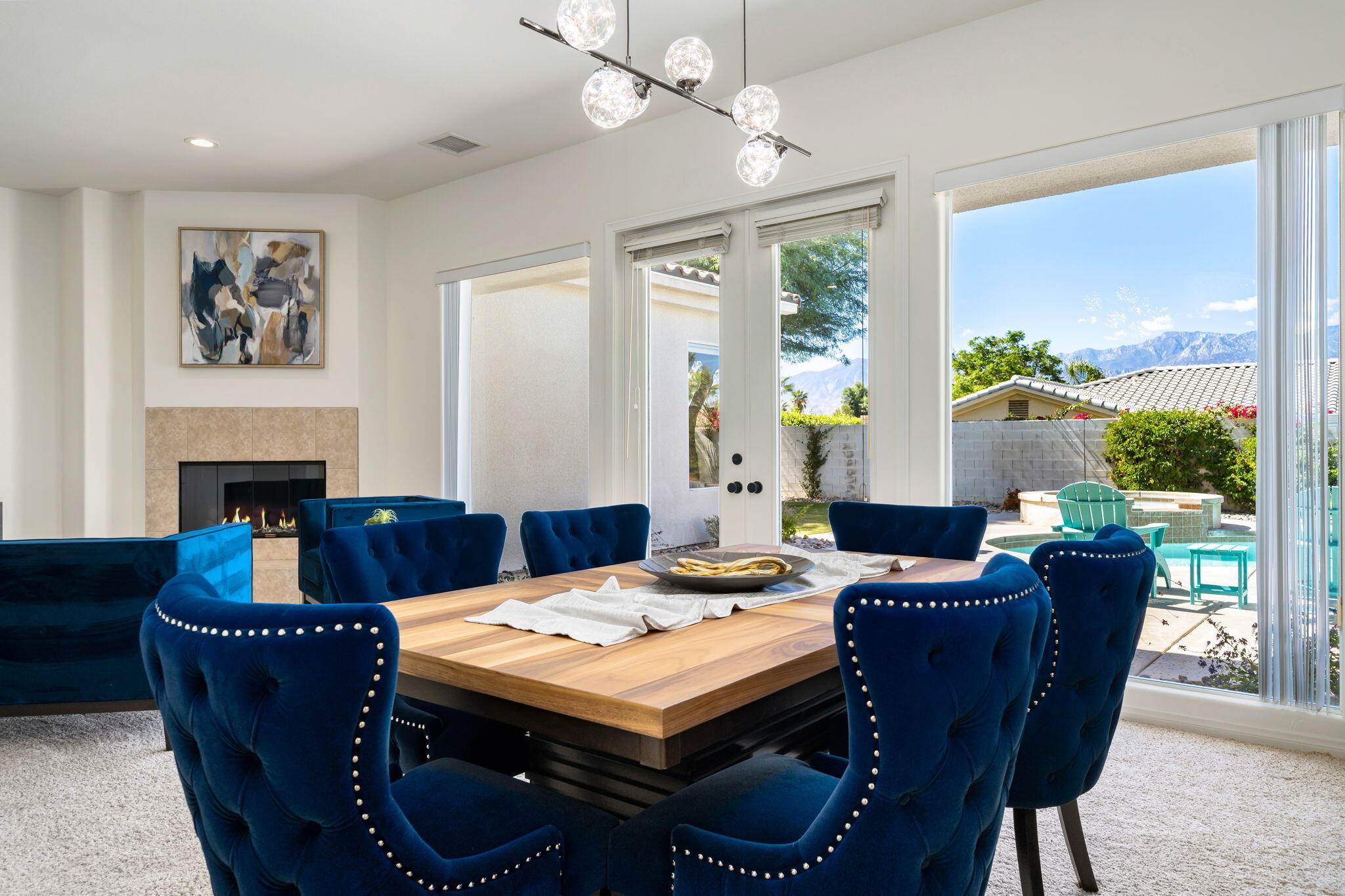 1 Waterloo Court Rancho Mirage, CA 92270 - Photo 19 of 54 a view of a dining room with furniture window and wooden floor