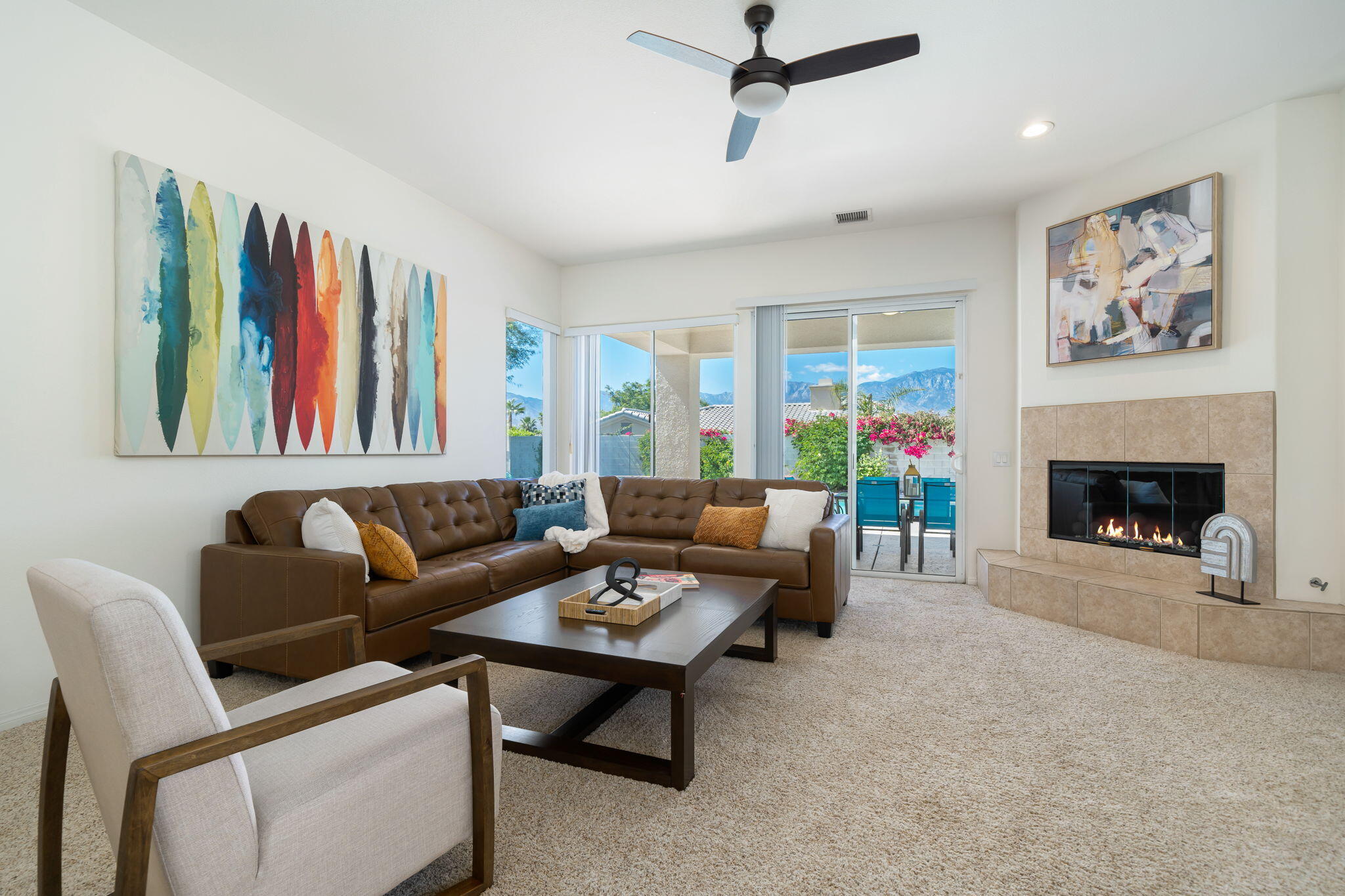 1 Waterloo Court Rancho Mirage, CA 92270 - Photo 21 of 54 a living room with furniture a rug and a fireplace