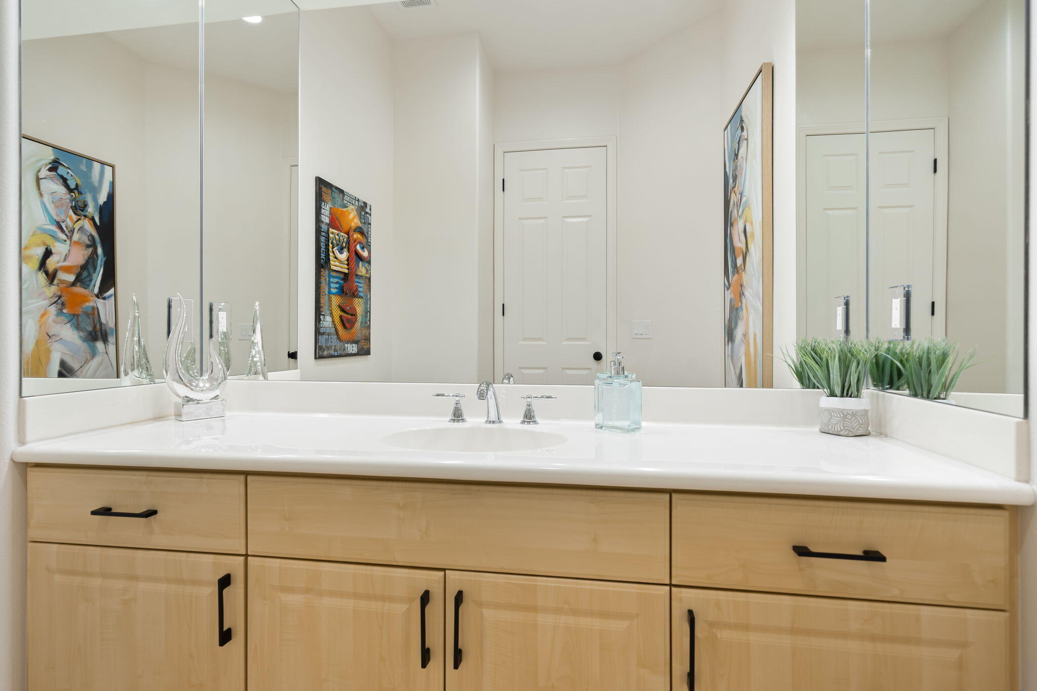 1 Waterloo Court Rancho Mirage, CA 92270 - Photo 22 of 54 a bathroom with a granite countertop sink and a mirror