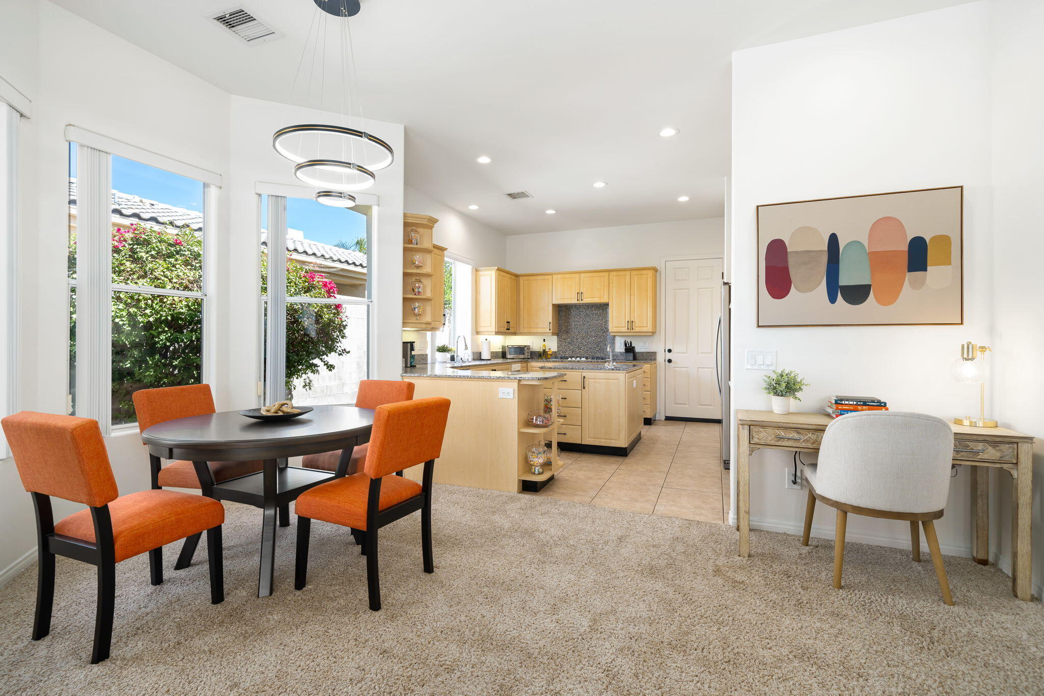 1 Waterloo Court Rancho Mirage, CA 92270 - Photo 24 of 54 a view of a dining room with furniture and a large window