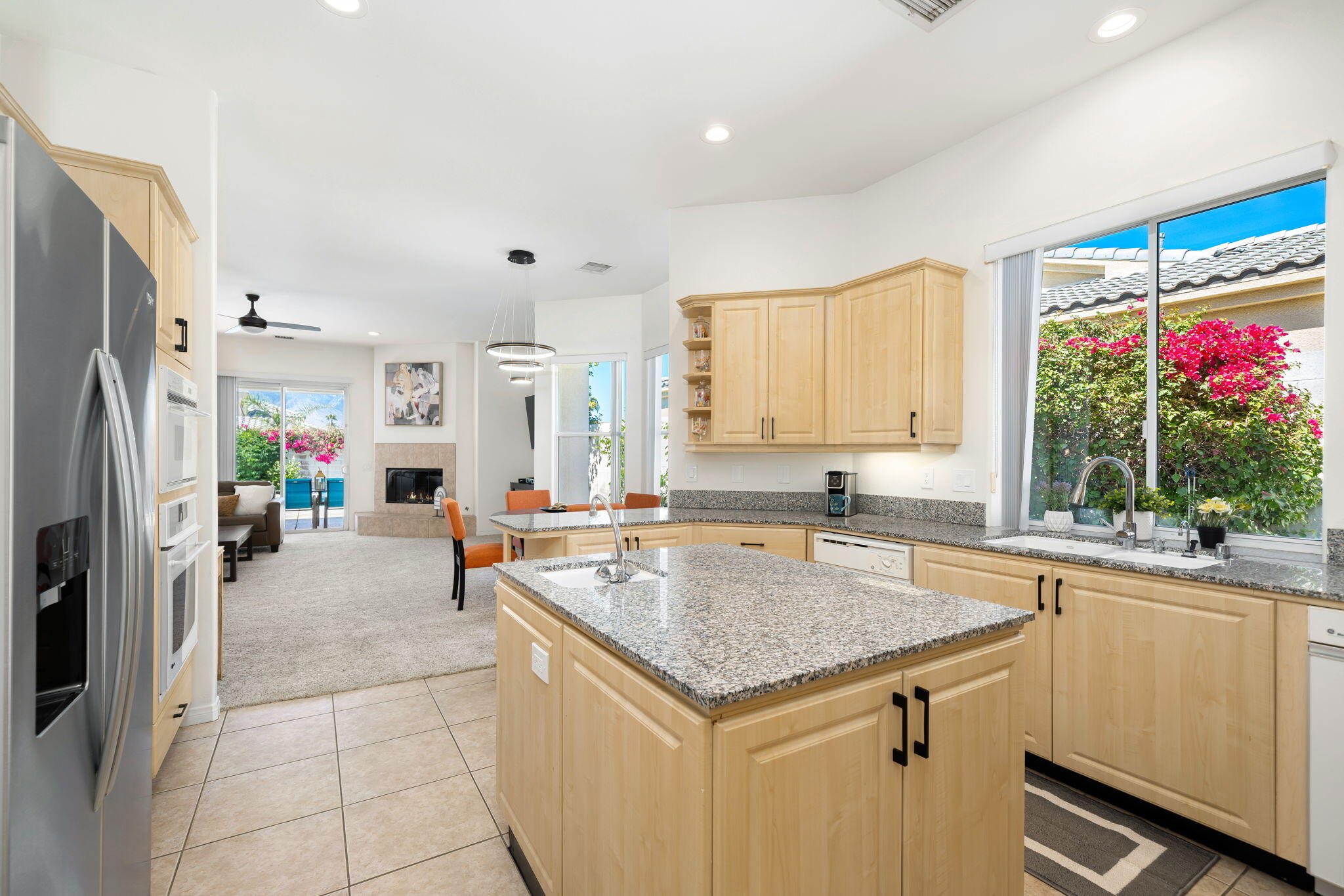 1 Waterloo Court Rancho Mirage, CA 92270 - Photo 28 of 54 a kitchen with a stove a refrigerator and a sink