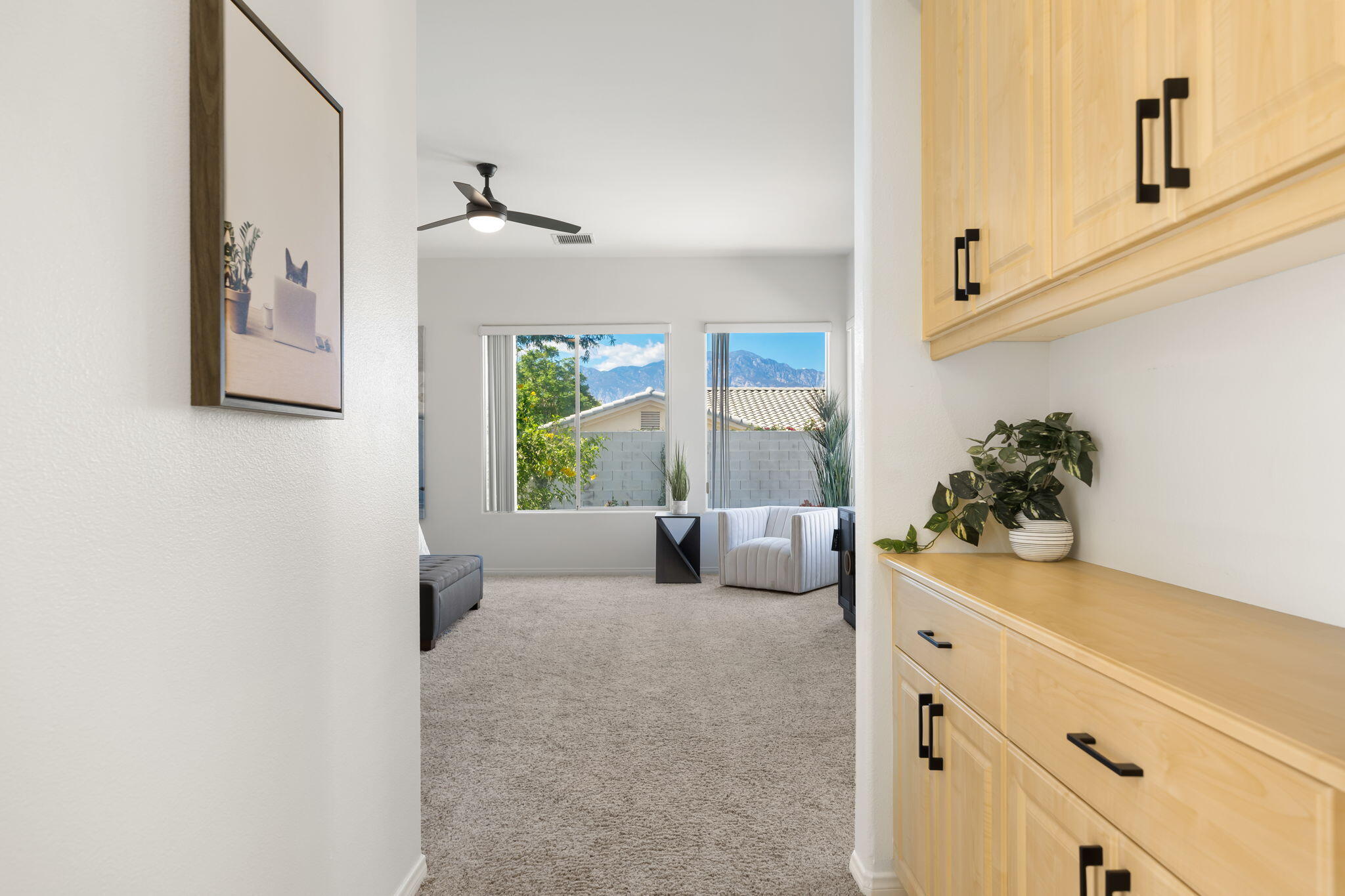 1 Waterloo Court Rancho Mirage, CA 92270 - Photo 32 of 54 a bedroom with furniture and a potted plant