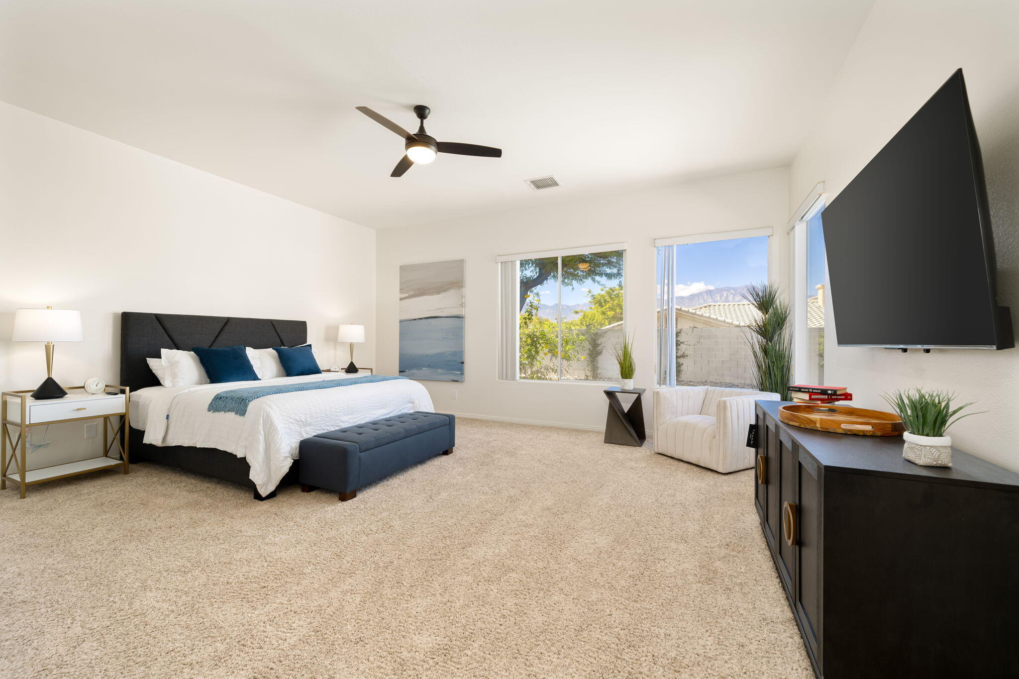 1 Waterloo Court Rancho Mirage, CA 92270 - Photo 33 of 54 a bedroom with bed and large flat screen tv