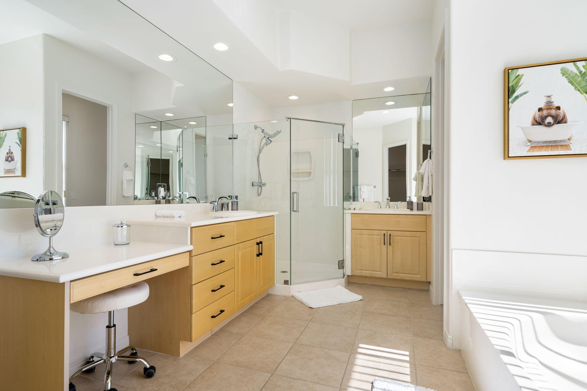1 Waterloo Court Rancho Mirage, CA 92270 - Photo 36 of 54 a spacious bathroom with a double vanity sink a mirror a bathtub and a shower
