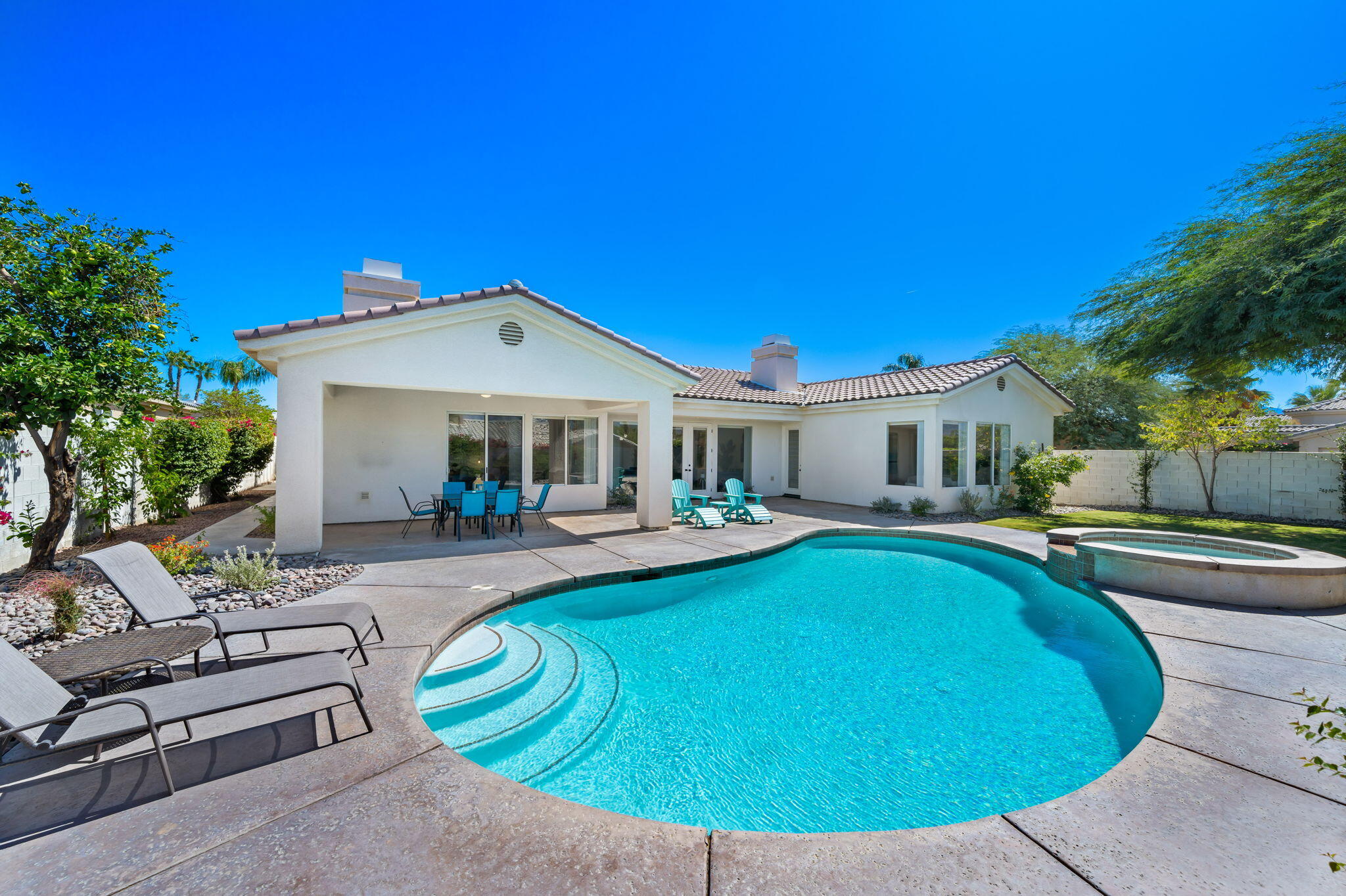 1 Waterloo Court Rancho Mirage, CA 92270 - Photo 50 of 54 a view of a house with swimming pool and sitting area