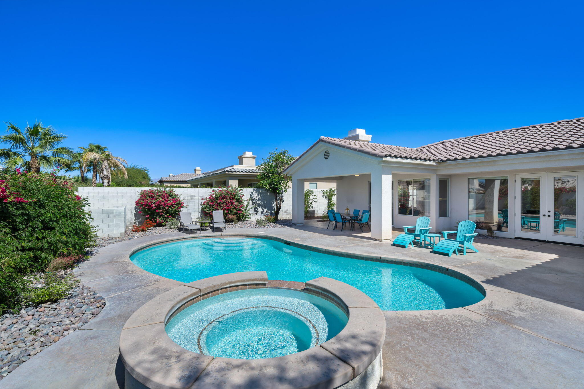1 Waterloo Court Rancho Mirage, CA 92270 - Photo 51 of 54 a view of a house with swimming pool and sitting area