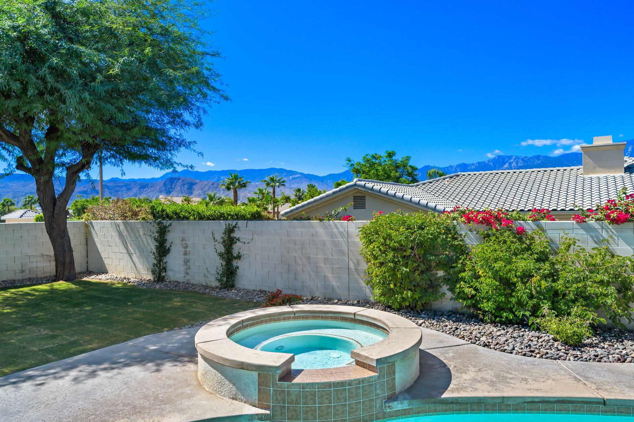 1 Waterloo Court Rancho Mirage, CA 92270 - Photo 53 of 54 a front view of a house with garden