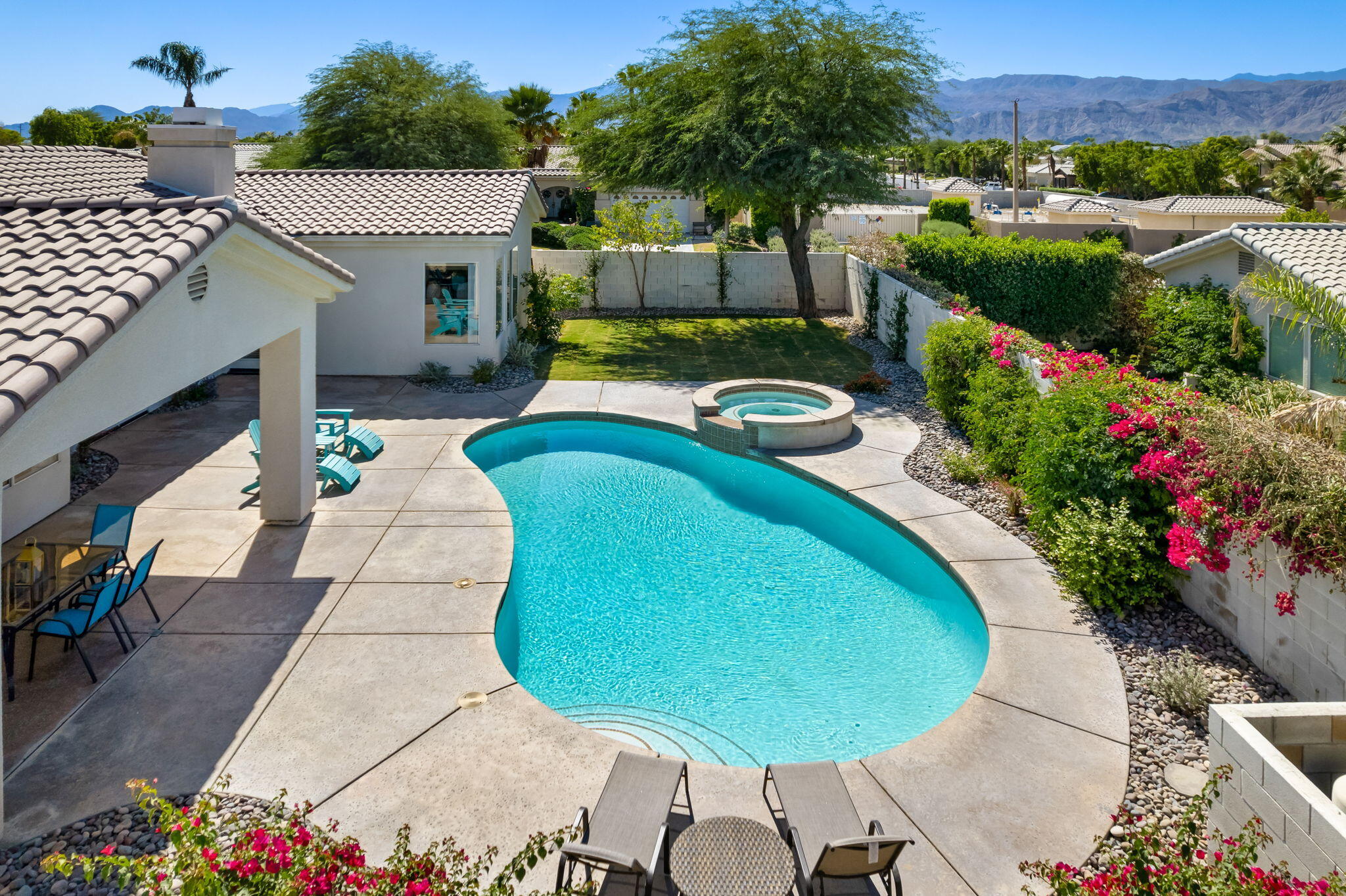 1 Waterloo Court Rancho Mirage, CA 92270 - Photo 6 of 54 an aerial view of a house with swimming pool and patio