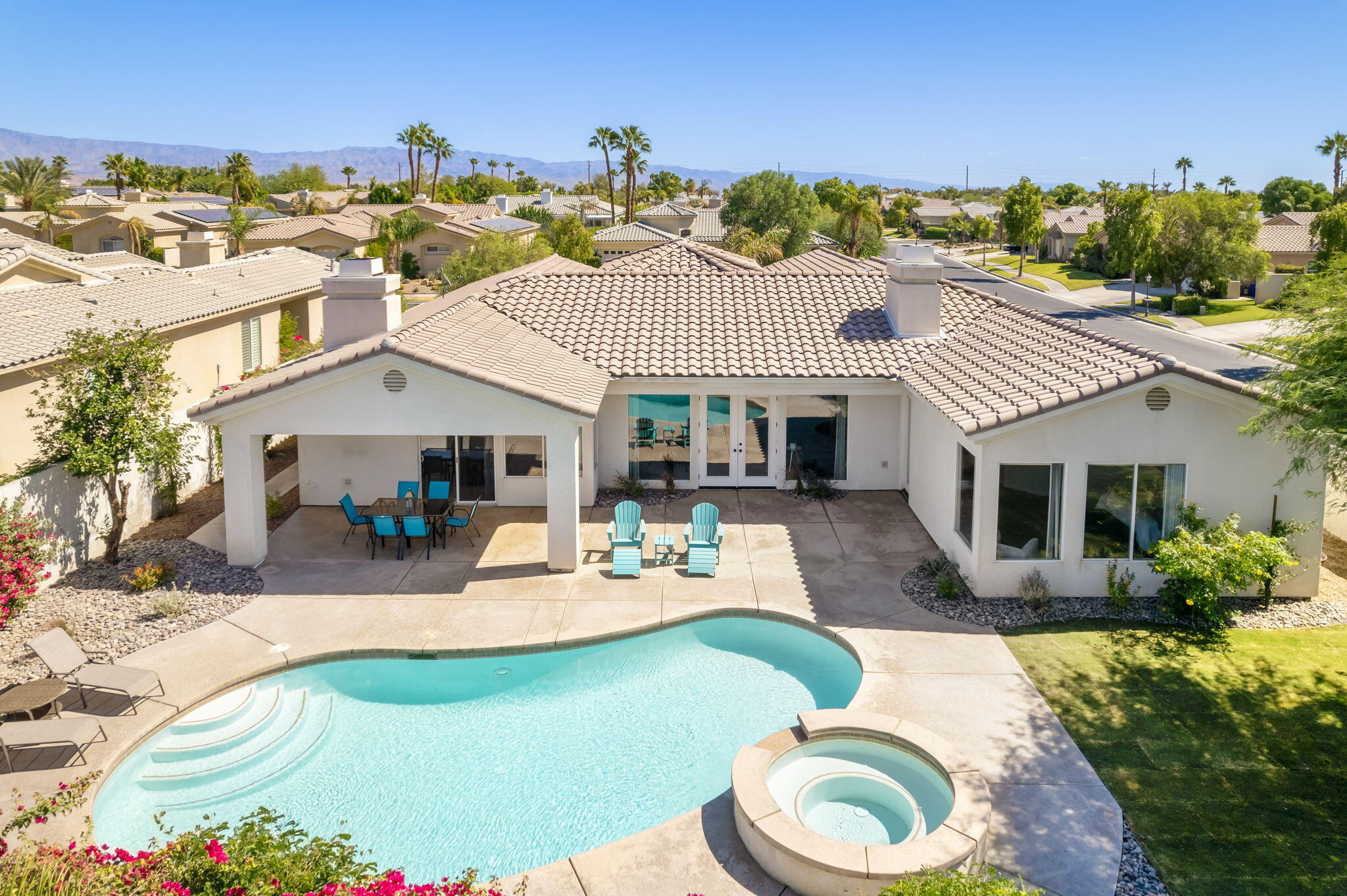 1 Waterloo Court Rancho Mirage, CA 92270 - Photo 7 of 54 a view of a house with backyard porch and sitting area