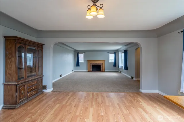 a bedroom with a bed and a fireplace