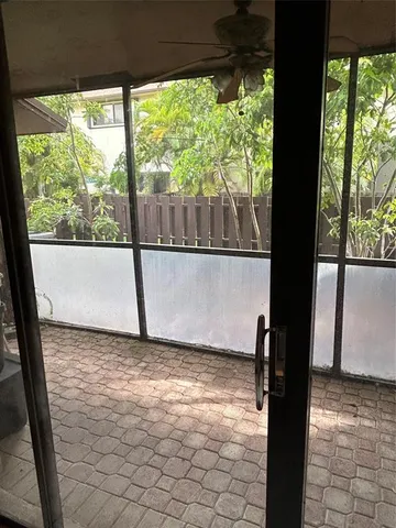 a view of a black and white kitchen