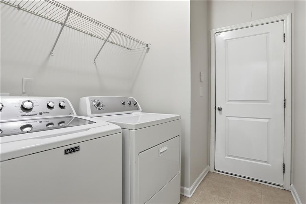 236 Manous Way Canton, GA 30115 - Photo 22 of 25 a utility room with dryer and washer