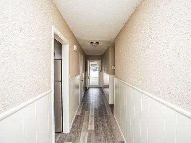 4309 42nd Street Lubbock, TX 79413 - Photo 4 of 21 a view of a hallway with wooden floor