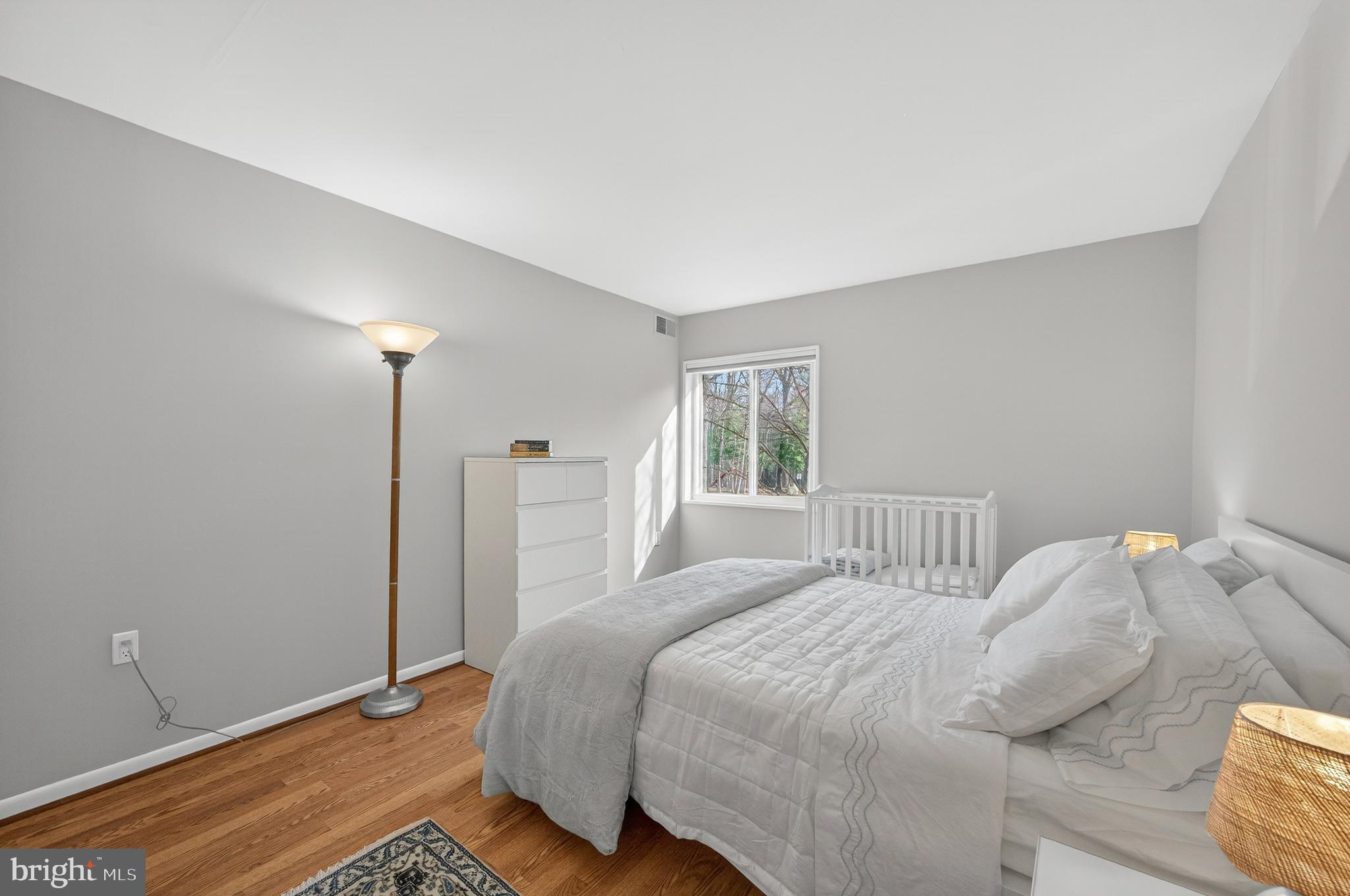1536 Northgate Square, Unit 21 Reston, VA 20190 - Photo 15 of 50 a bedroom with a bed and a window