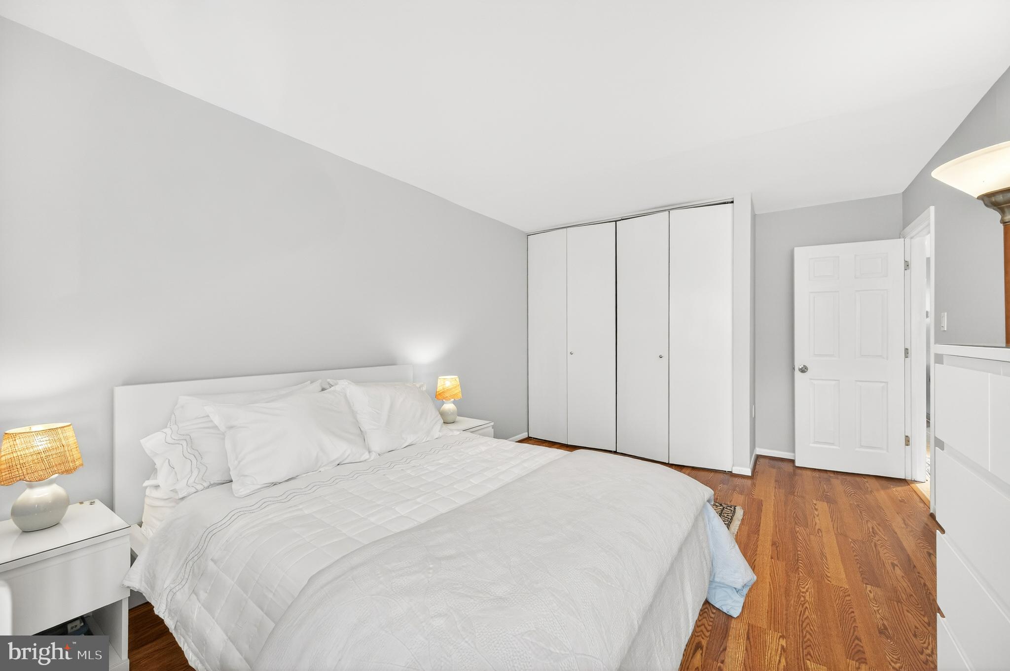 1536 Northgate Square, Unit 21 Reston, VA 20190 - Photo 16 of 50 a bedroom with a bed and a cabinets