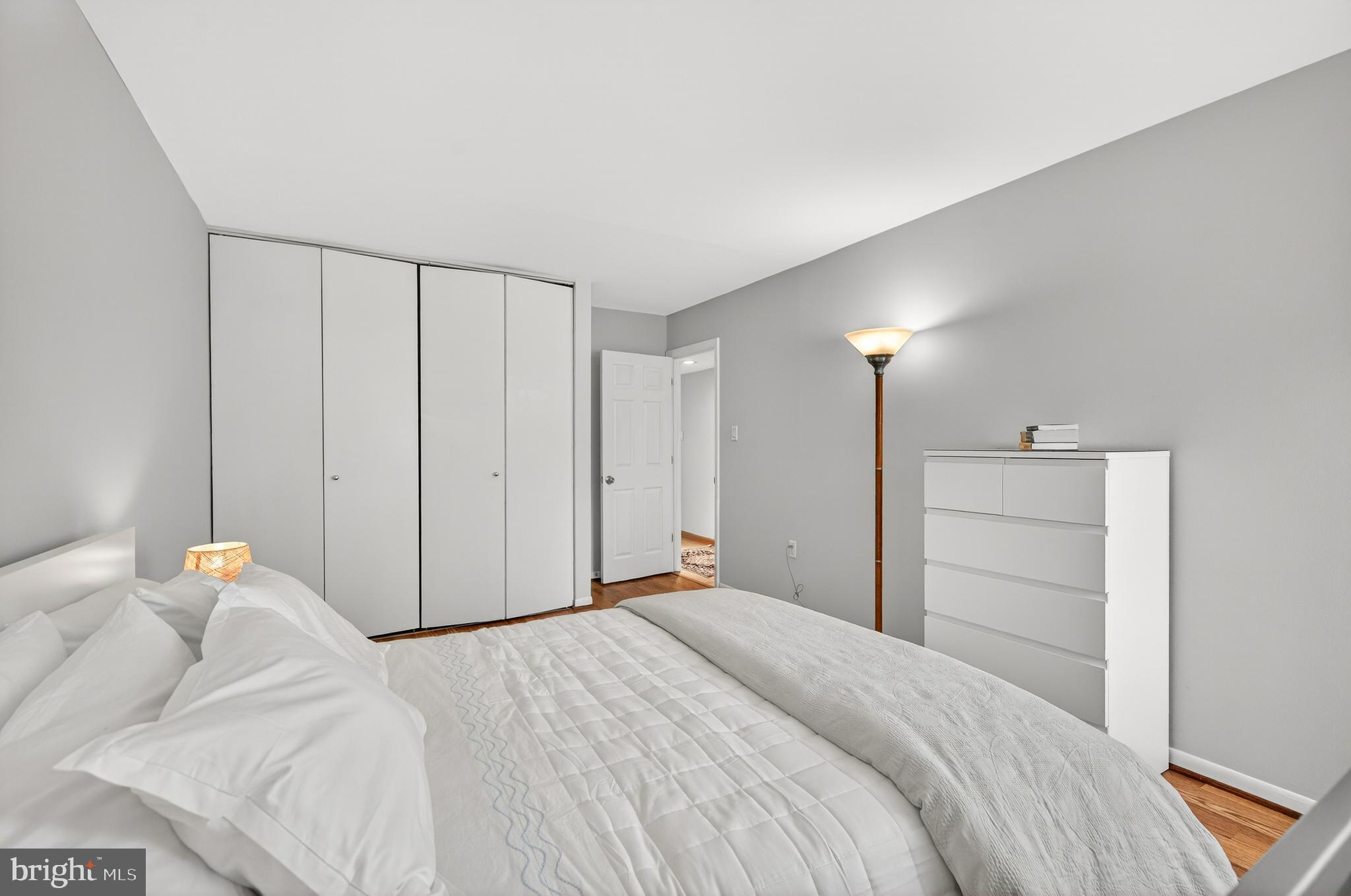 1536 Northgate Square, Unit 21 Reston, VA 20190 - Photo 17 of 50 a bedroom with a bed and a closet