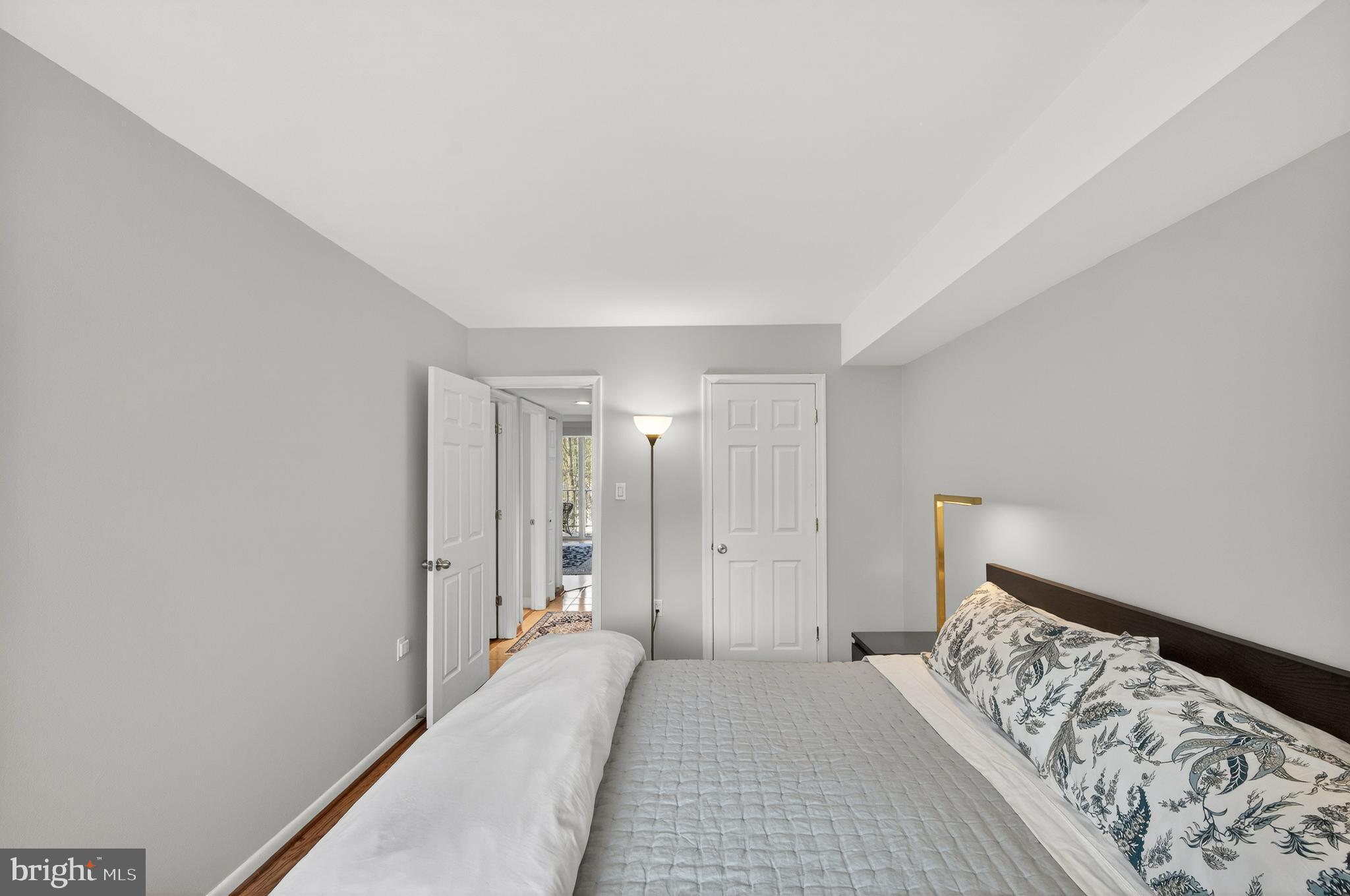 1536 Northgate Square, Unit 21 Reston, VA 20190 - Photo 19 of 50 a bedroom with a bed and a window