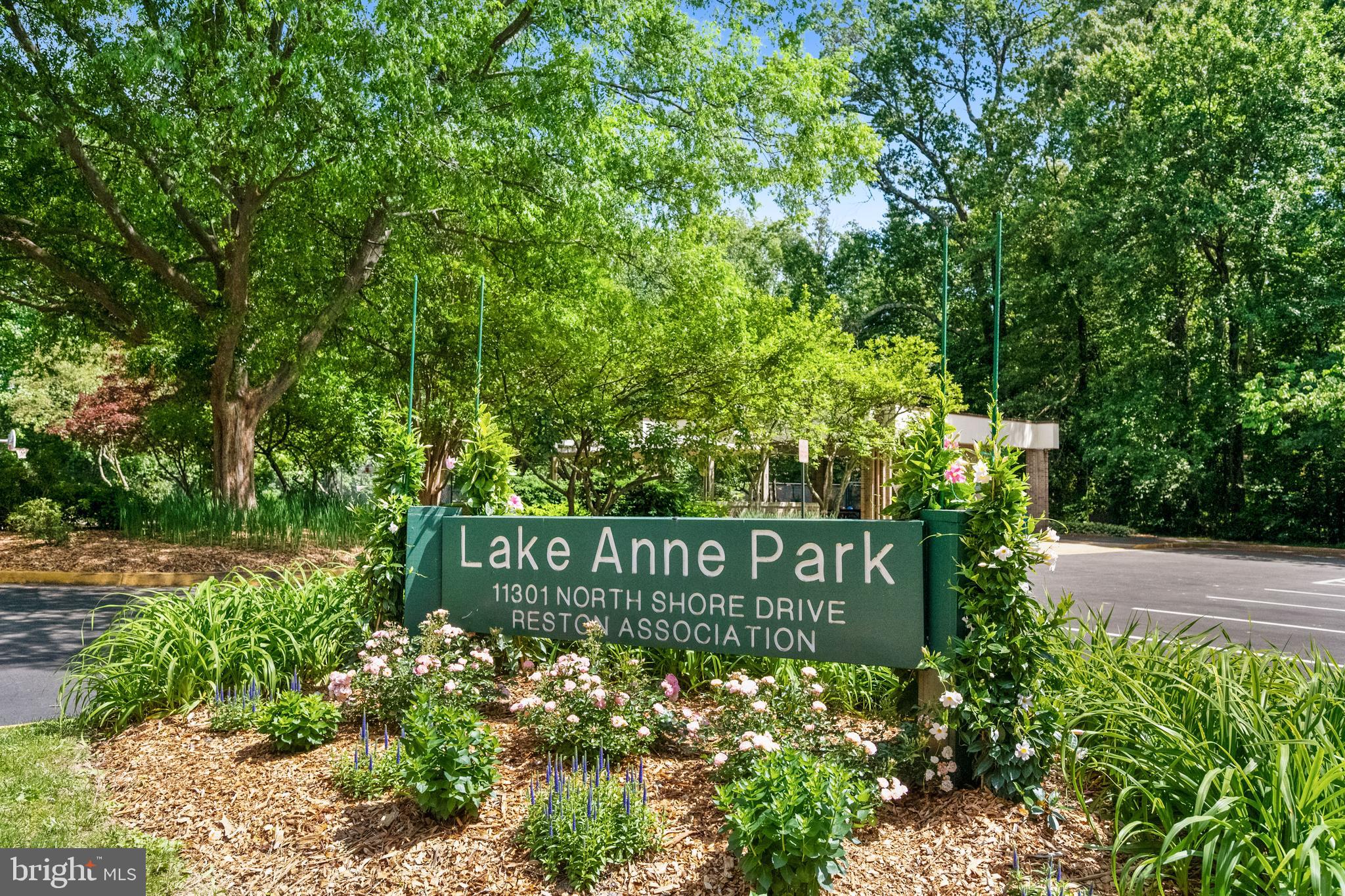 1536 Northgate Square, Unit 21 Reston, VA 20190 - Photo 29 of 50 a sign that is sitting in front of flowers