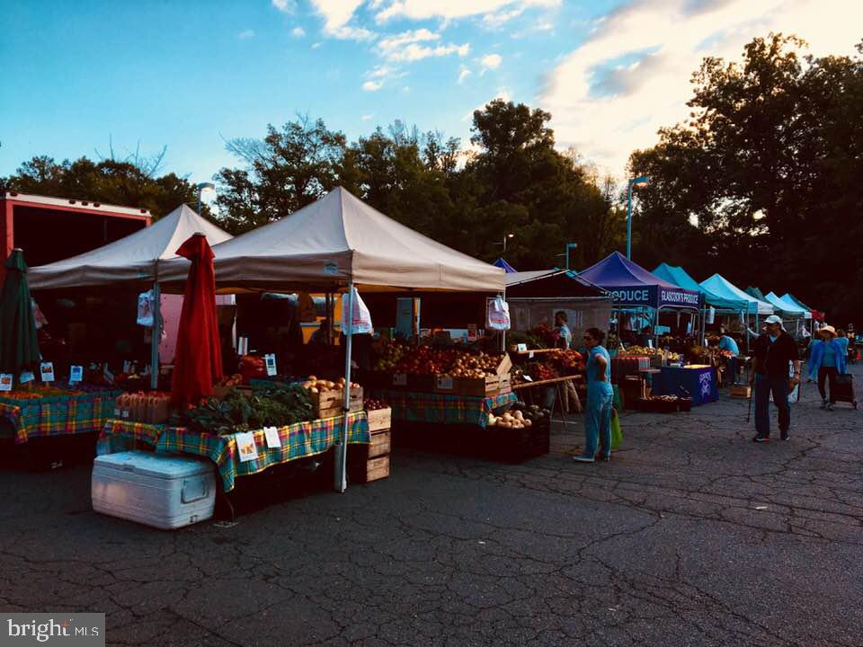 1536 Northgate Square, Unit 21 Reston, VA 20190 - Photo 45 of 50 a group of people sitting in front of retail shop