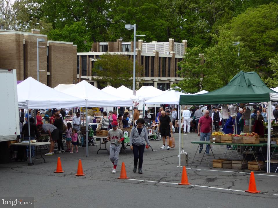 1536 Northgate Square, Unit 21 Reston, VA 20190 - Photo 46 of 50 a group of people sitting under an umbrella