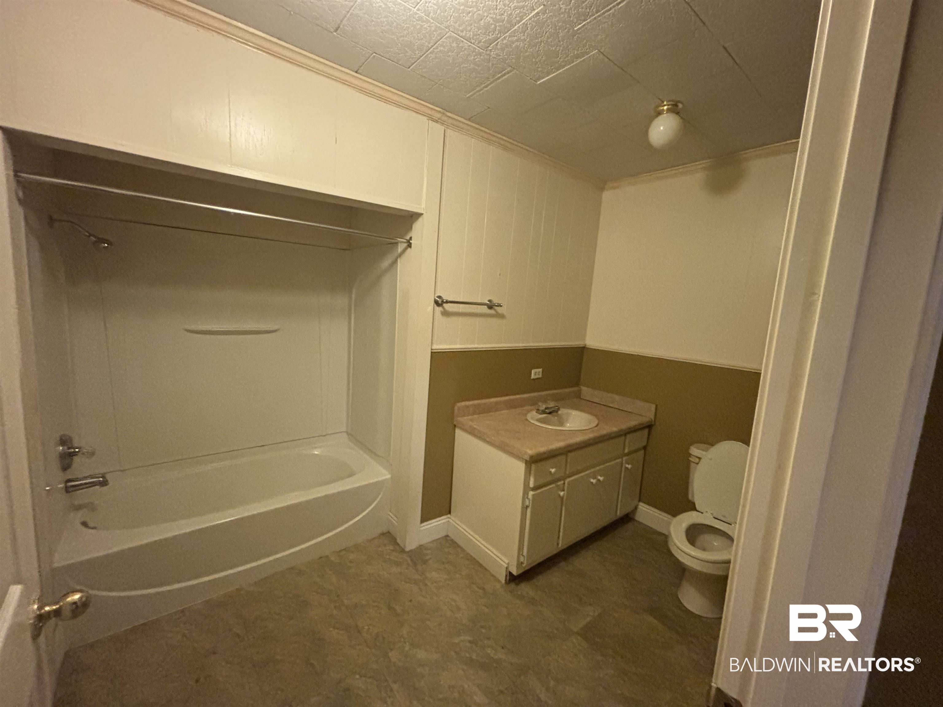 17495 County Road 48 Robertsdale, AL 36567 - Photo 32 of 37 Full bathroom with shower combination, vanity, and toilet