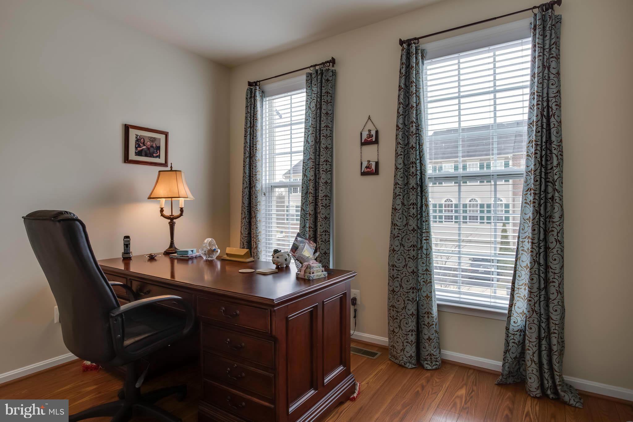 2242 Henry Watts Loop Woodbridge, VA 22191 - Photo 3 of 30 a room with furniture and window