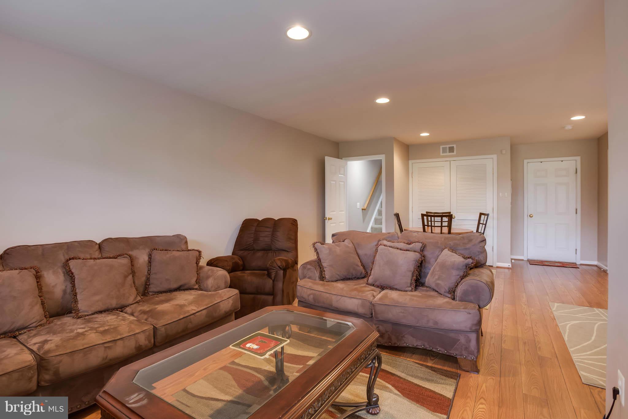 2242 Henry Watts Loop Woodbridge, VA 22191 - Photo 24 of 30 a living room with furniture and a couch
