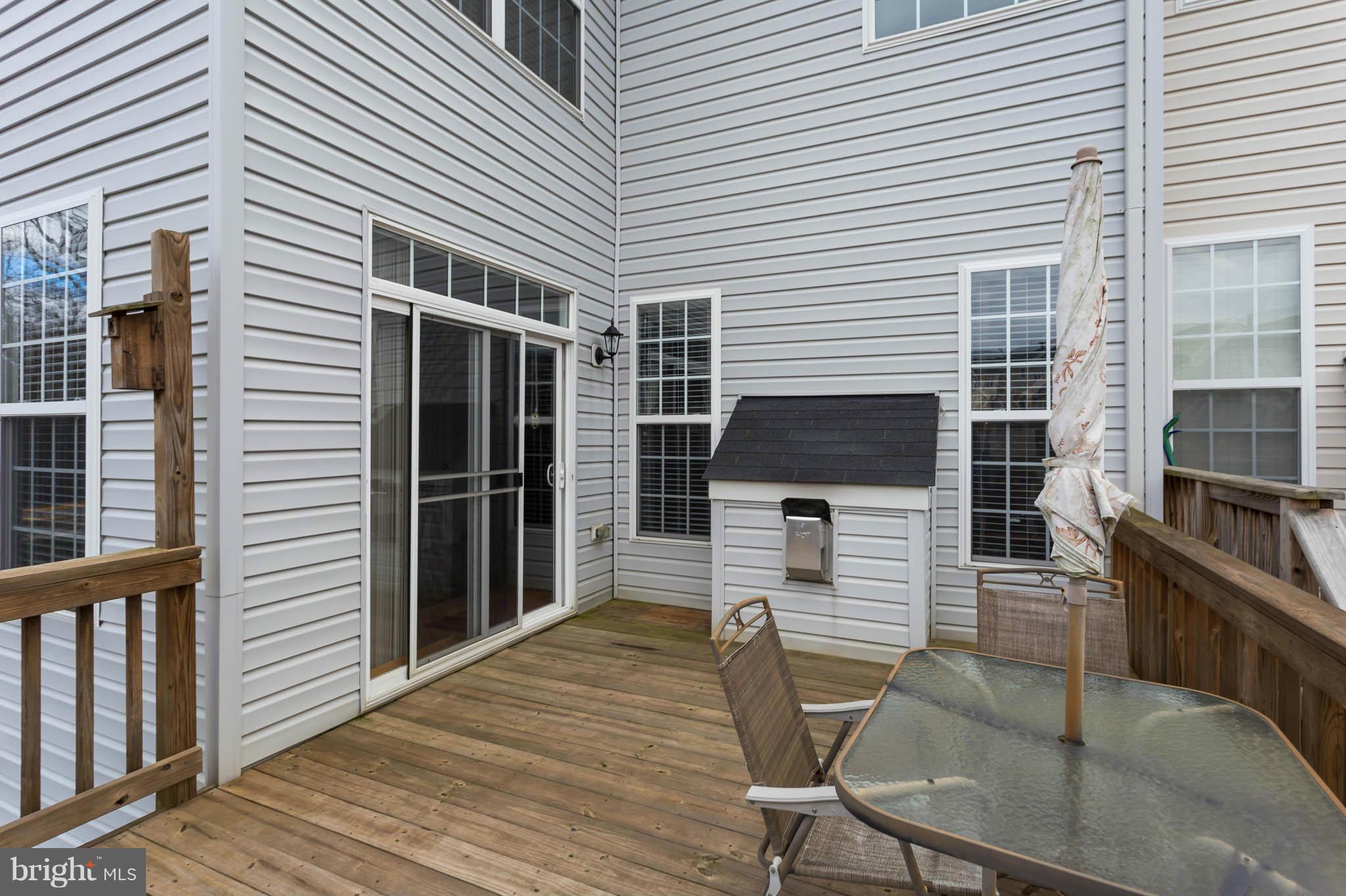 2242 Henry Watts Loop Woodbridge, VA 22191 - Photo 29 of 30 a porch with seating space and appliances