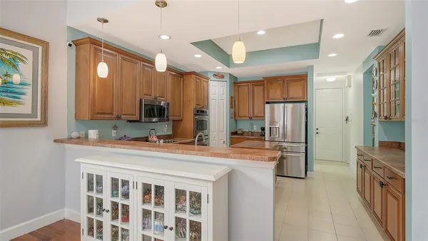 a kitchen with stainless steel appliances granite countertop a sink and cabinets