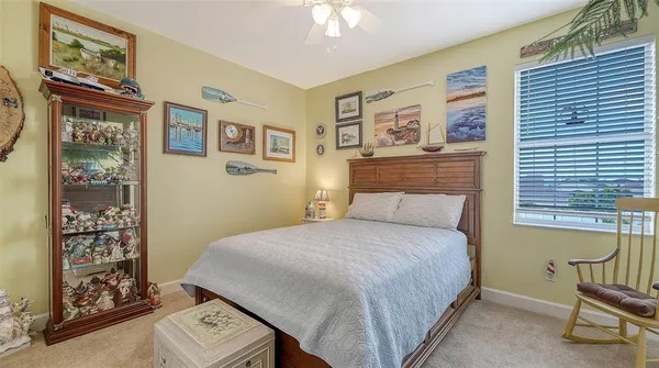 a view of a livingroom with furniture and closet area