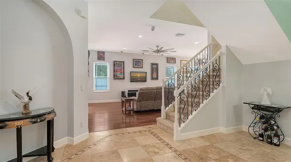 a view of a dining room with furniture wooden floor and a chandelier