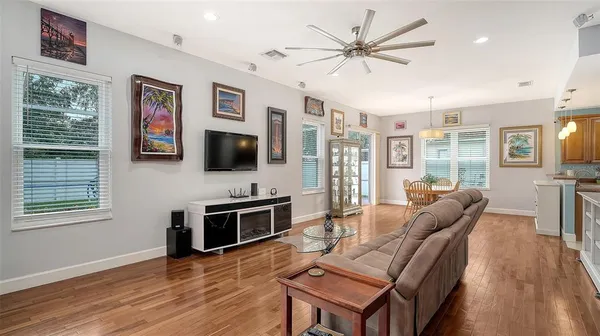 a living room with furniture and wooden floor