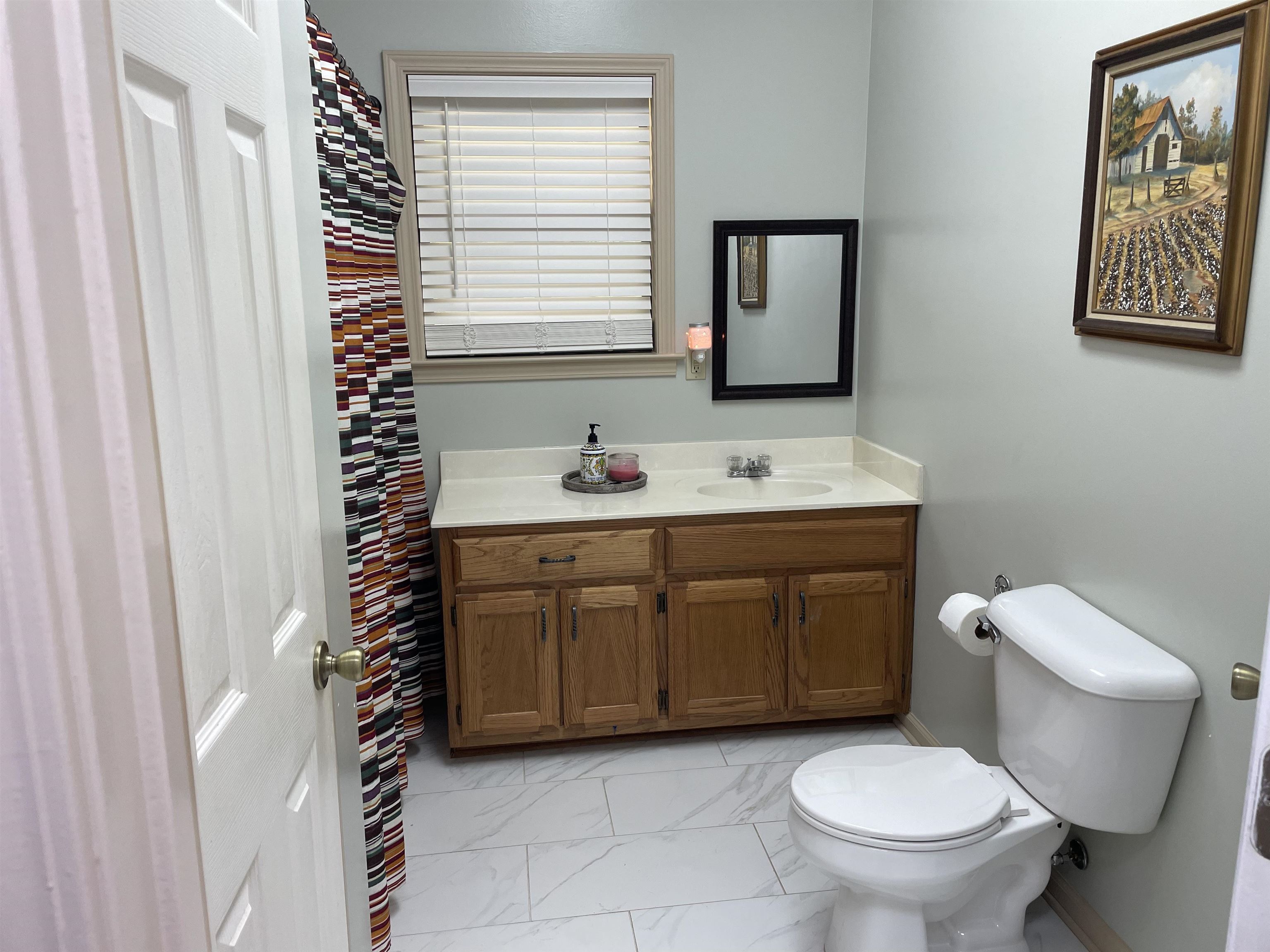 2879 Randolph Road Burlison, TN 38015 - Photo 12 of 29 Bathroom featuring toilet, tile patterned floors, and vanity