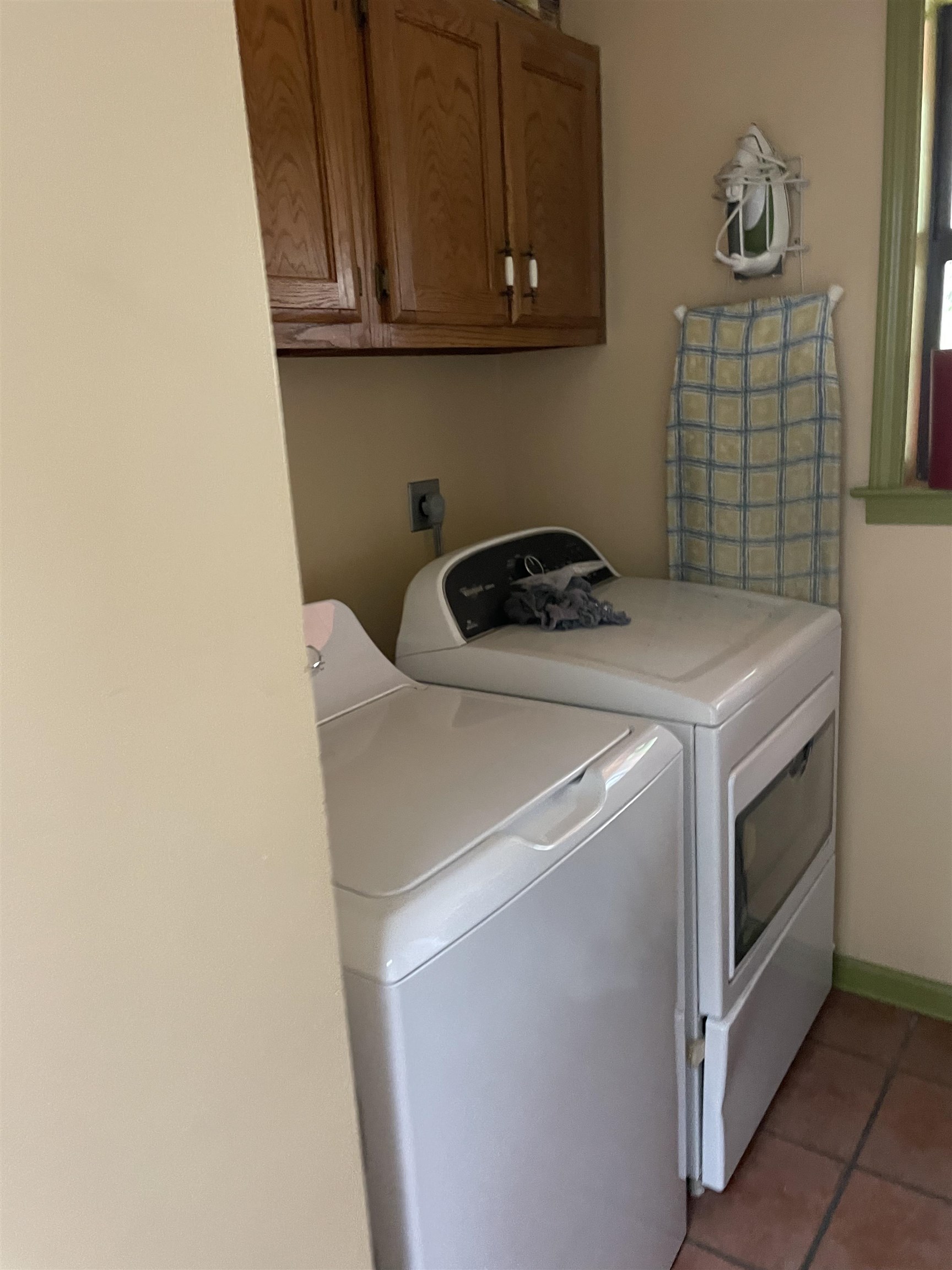 2879 Randolph Road Burlison, TN 38015 - Photo 25 of 29 Laundry area featuring cabinets, light tile patterned flooring, and washer and clothes dryer