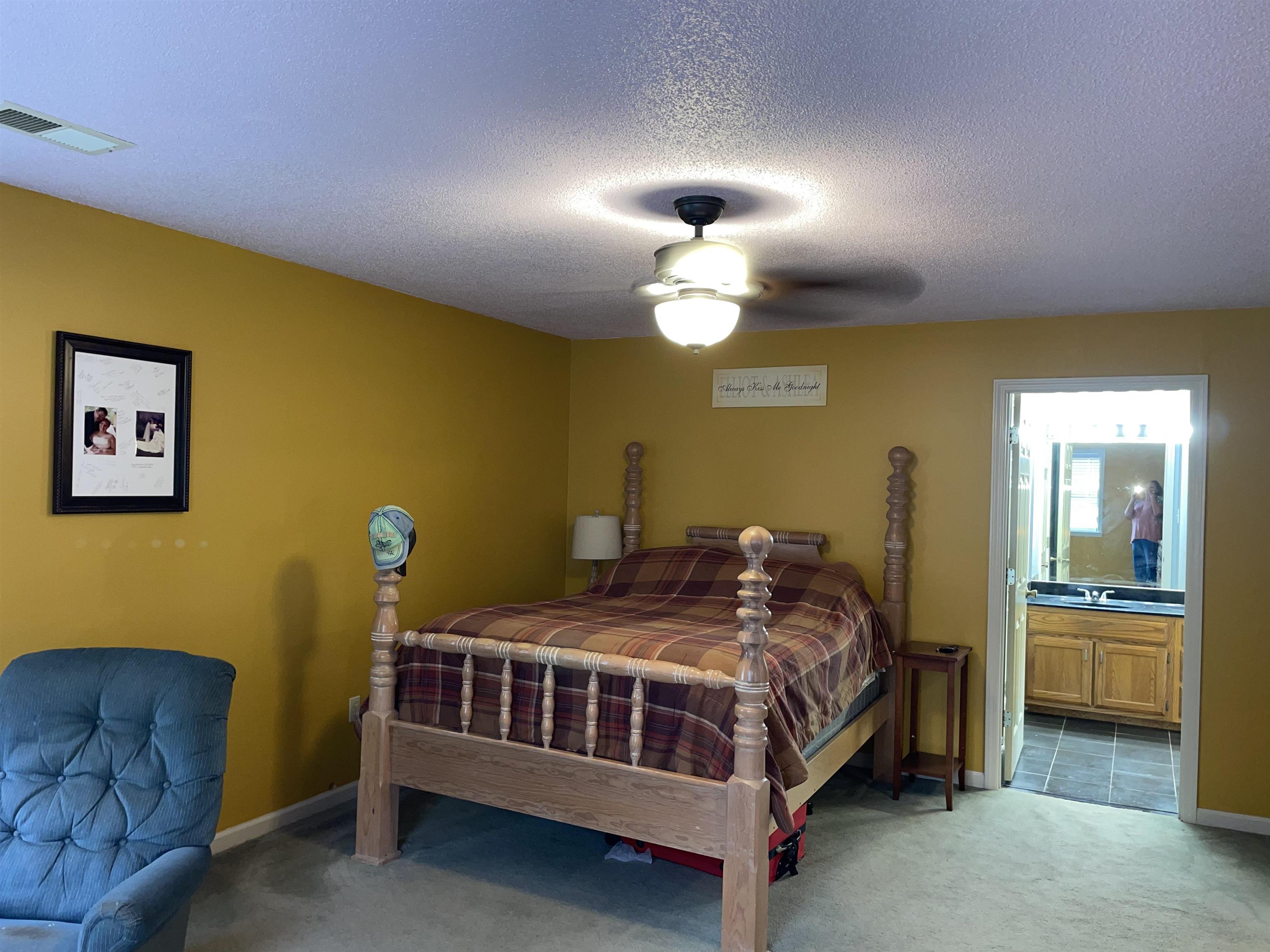 2879 Randolph Road Burlison, TN 38015 - Photo 26 of 29 Tiled bedroom with a textured ceiling, ceiling fan, and ensuite bathroom