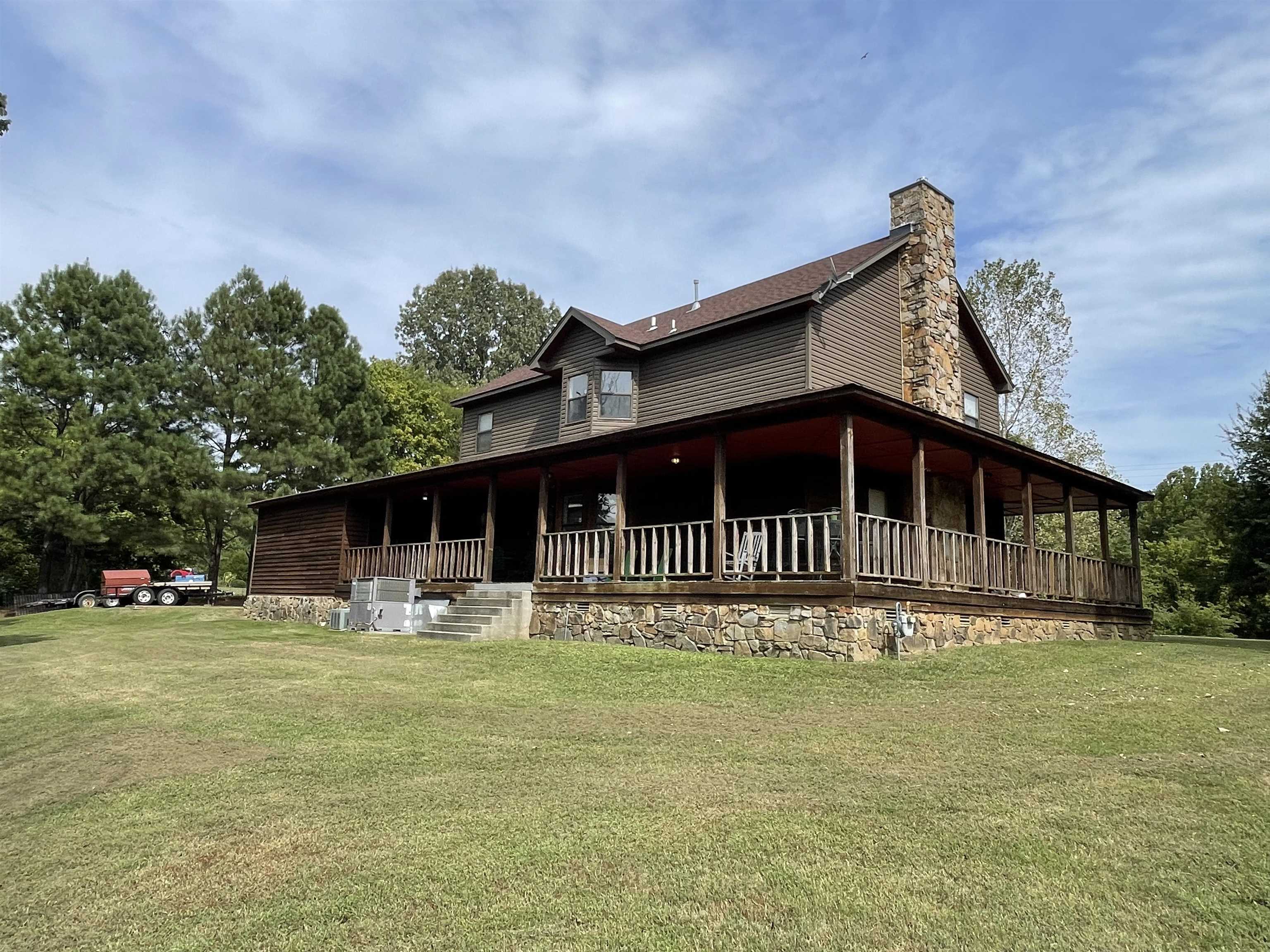 2879 Randolph Road Burlison, TN 38015 - Photo 9 of 29 Back of house featuring a porch and a lawn