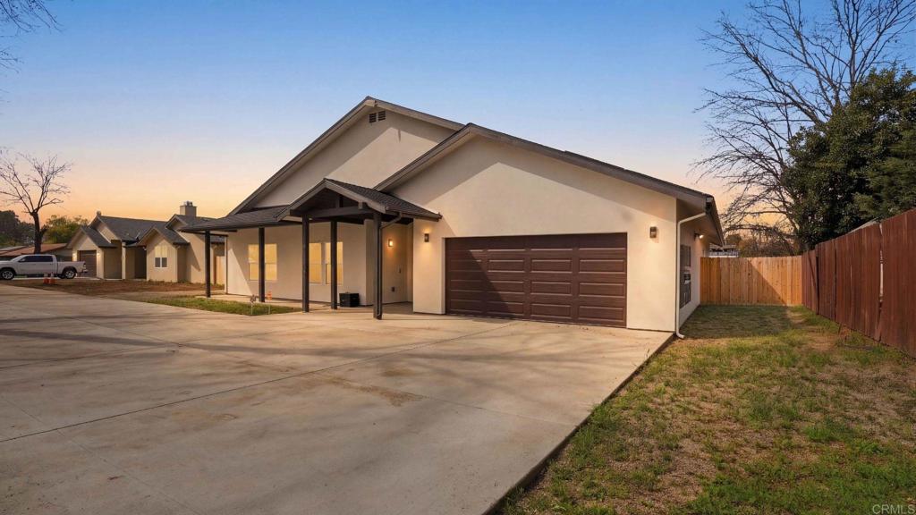 9391 Los Coches Road Lakeside, CA 92040 - Photo 1 of 65 a front view of a house with a garage