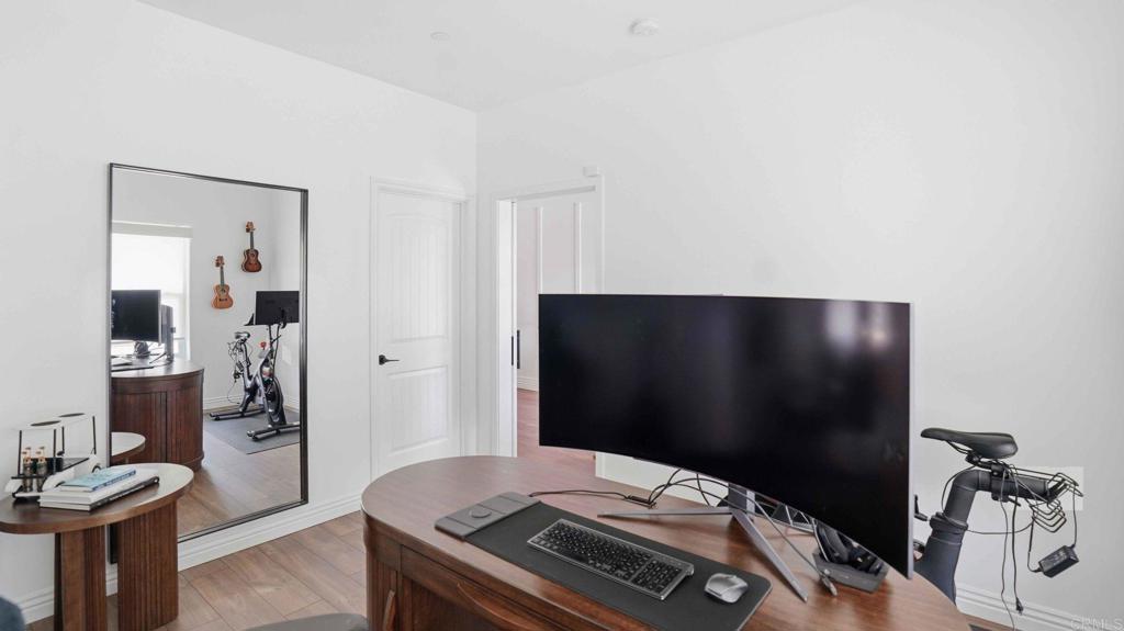 9391 Los Coches Road Lakeside, CA 92040 - Photo 12 of 65 a bedroom with a bed and a television