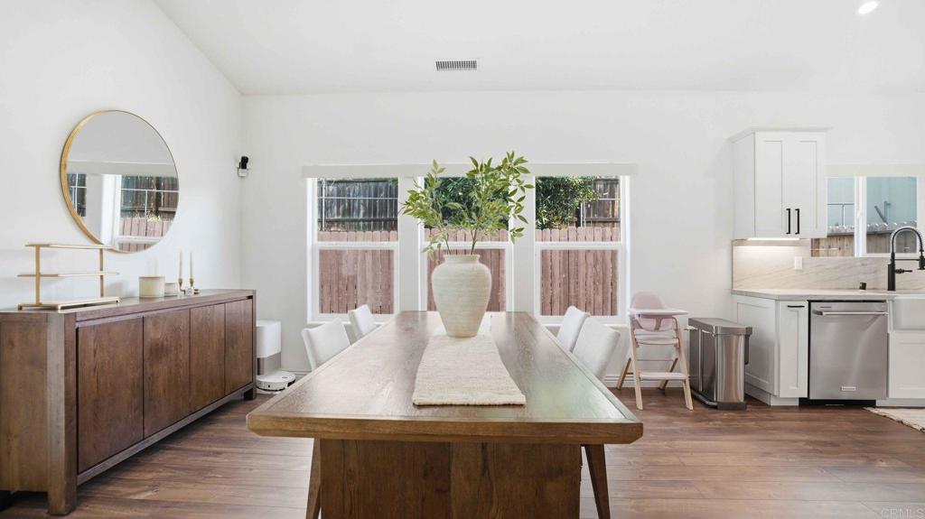 9391 Los Coches Road Lakeside, CA 92040 - Photo 16 of 65 a view of a dining room with furniture and wooden floor