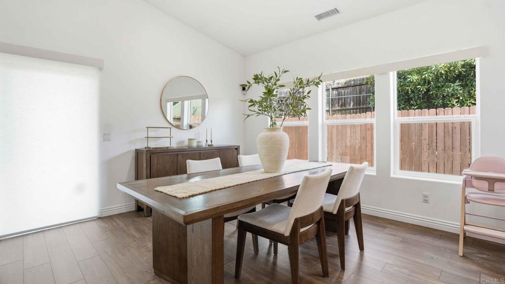 9391 Los Coches Road Lakeside, CA 92040 - Photo 17 of 65 a view of a dining room with furniture window and wooden floor