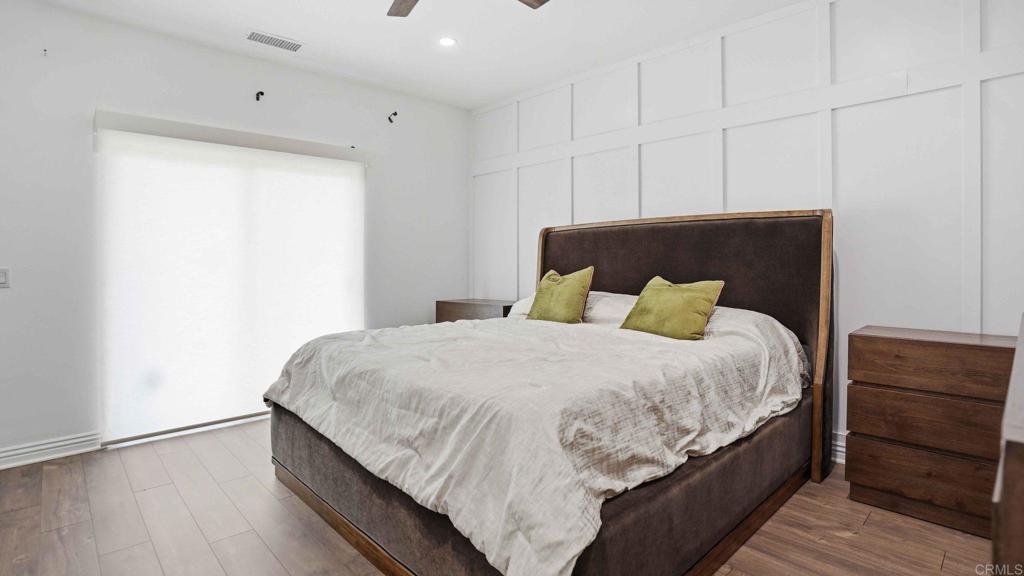 9391 Los Coches Road Lakeside, CA 92040 - Photo 28 of 65 a large bed sitting in a bedroom next to a cabinet