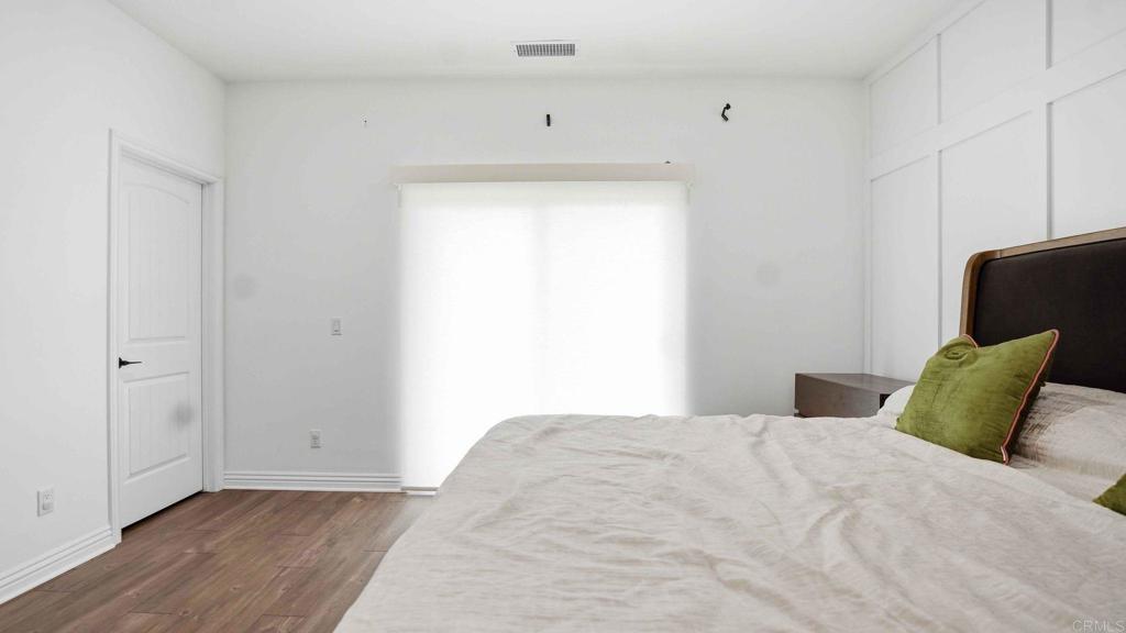 9391 Los Coches Road Lakeside, CA 92040 - Photo 29 of 65 a bedroom with a bed and a window