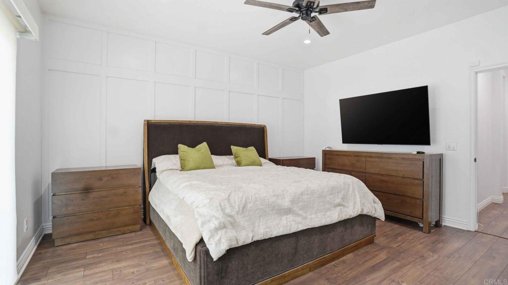 9391 Los Coches Road Lakeside, CA 92040 - Photo 30 of 65 a bedroom with a bed and a flat screen tv